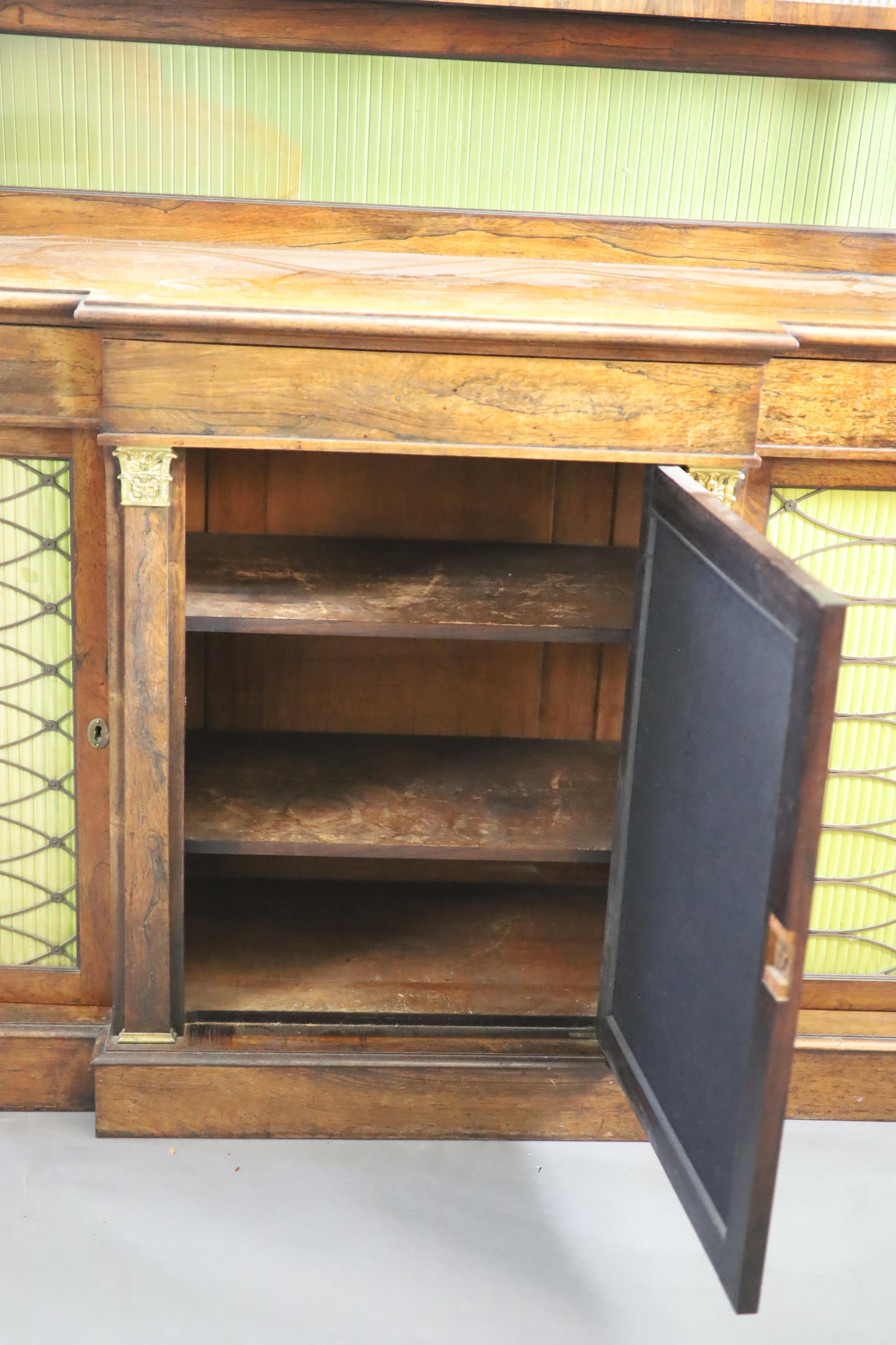 A Regency rosewood breakfront chiffonier, the raised back with three quarter gallery, W.136cm D.45cm H.123cm